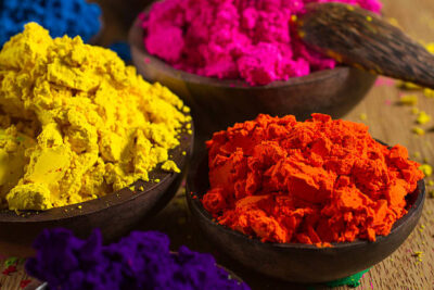 Colorful, finely powdered Indian pigments. Focus on orange.