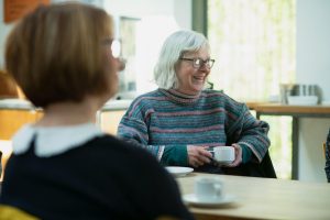 Active seniors relaxing in a comfortable lounge, highlighting the peaceful lifestyle and convenience offered by Carleton Place retirement residences.