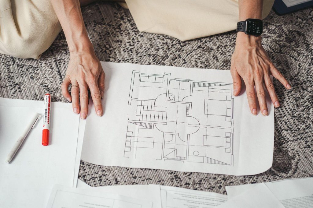 Commercial contractor in Toronto reviewing blueprints before starting a construction build.

